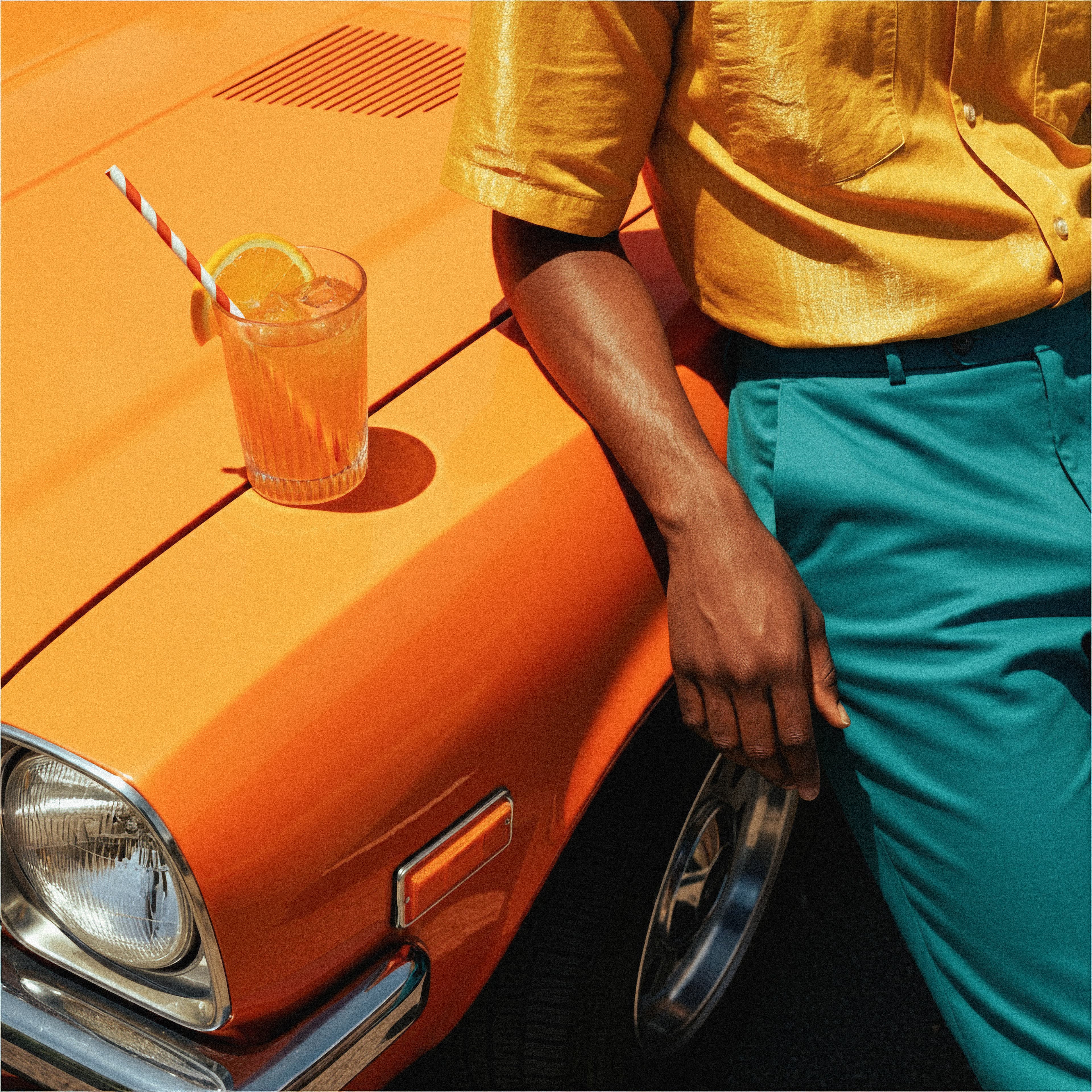 Citrus aperitivo served on a car in warm afternoon light.