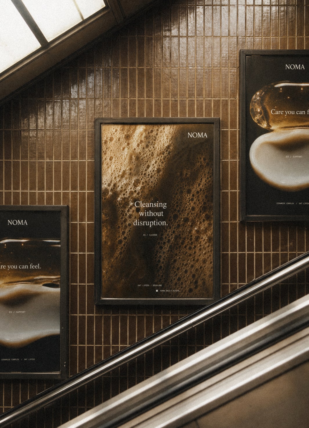 The NOMA campaign adapted across several poster sizes along a station staircase.